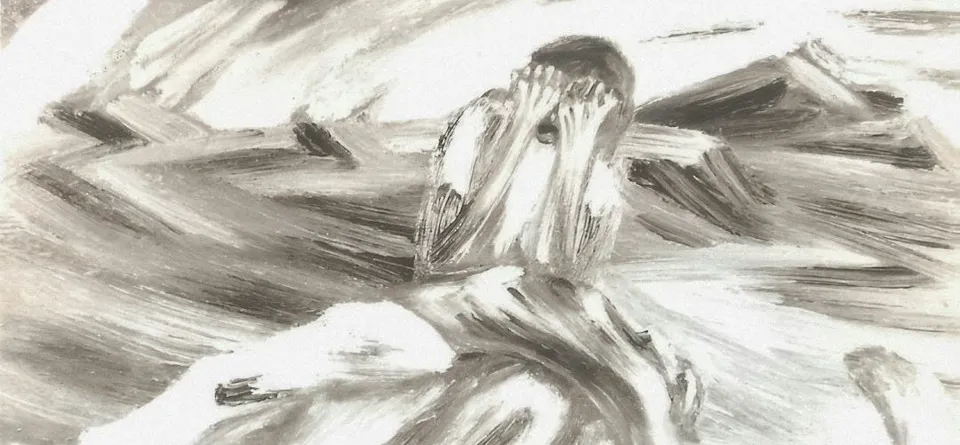 A figure sits hunched over, covering their face